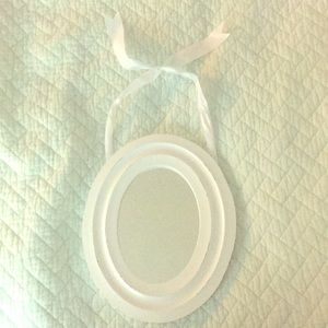 Oval white distressed hanging mirror